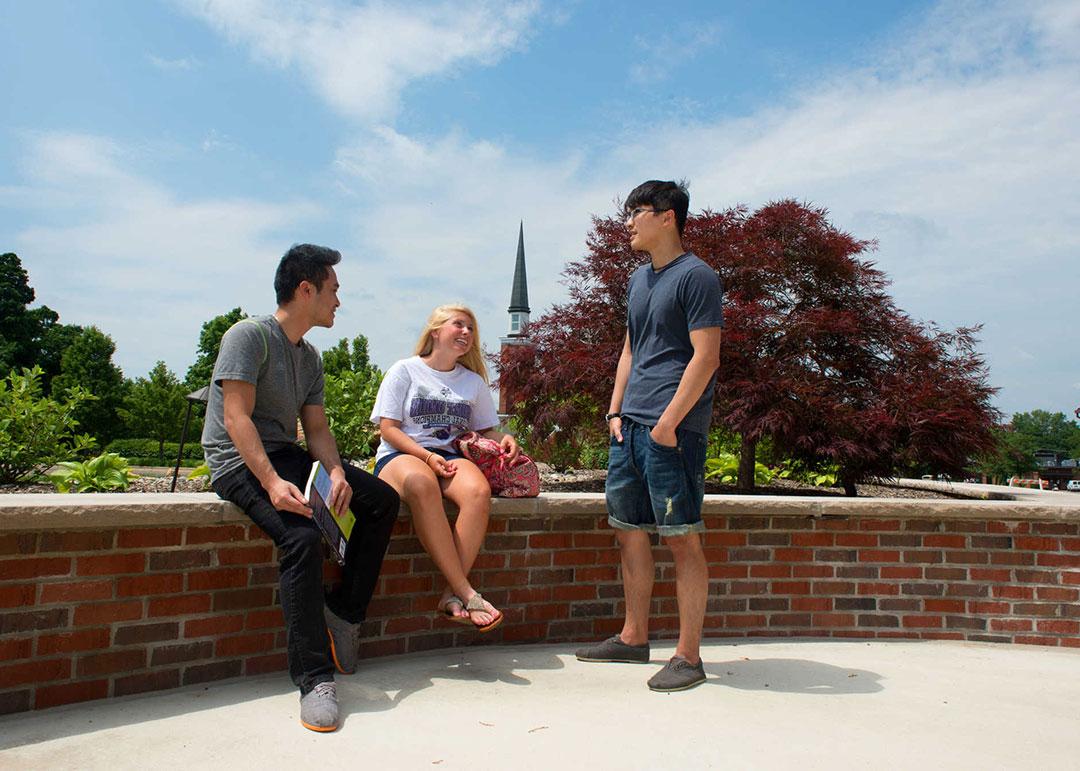 student sitting on campus